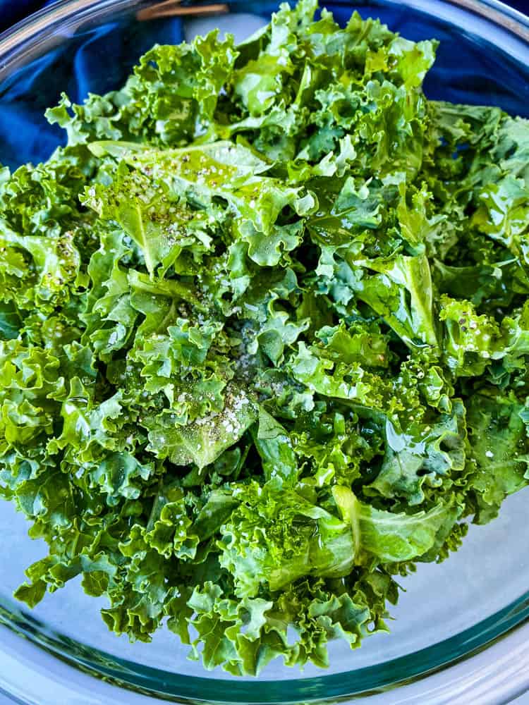 raw kale for air fryer kale chips in glass bowl