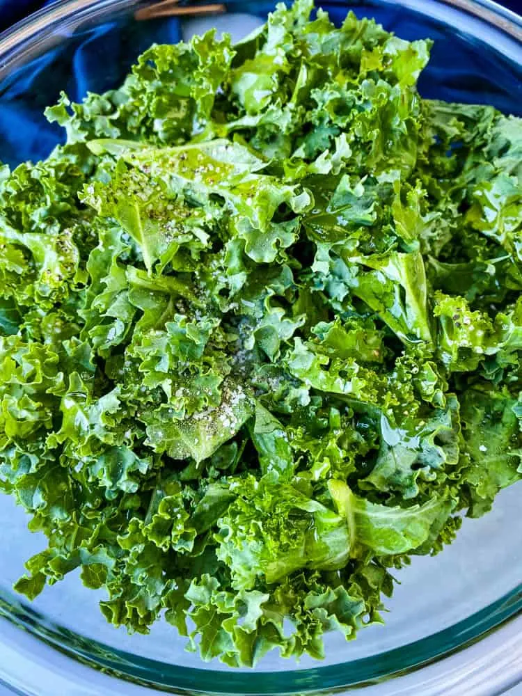 raw kale for air fryer kale chips in glass bowl