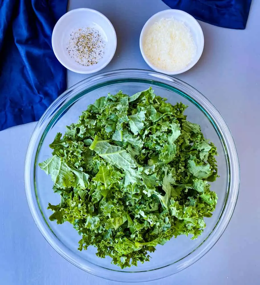 raw kale for air fryer kale chips in glass bowl