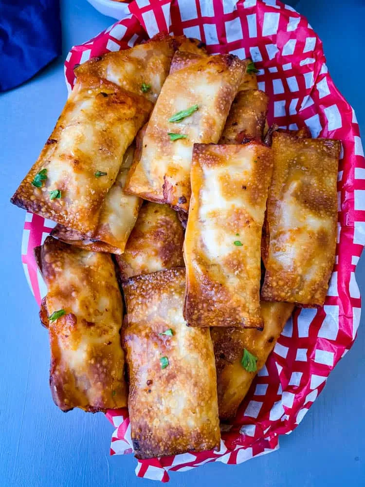 air fryer pizza rolls in a black bowl