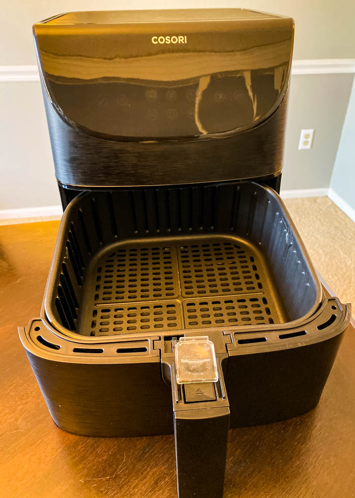 cosori 5.8 quart air fryer on a table