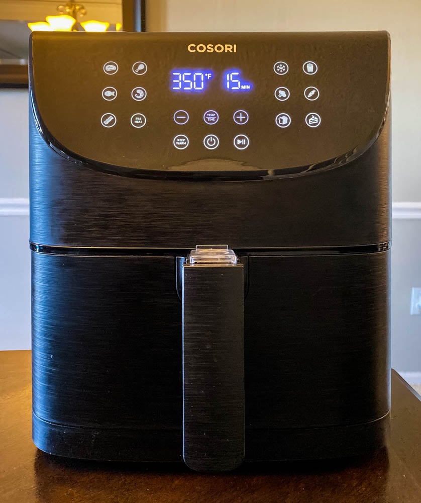 cosori 5.8 quart air fryer on a table