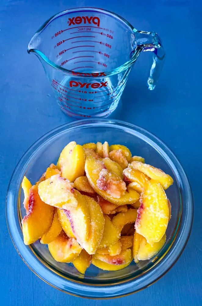frozen peaches in a glass bowl 