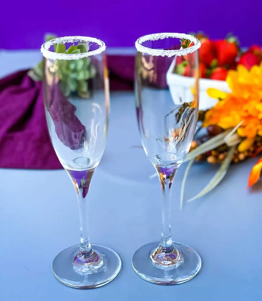 champagne flutes lined with sugar at the rim