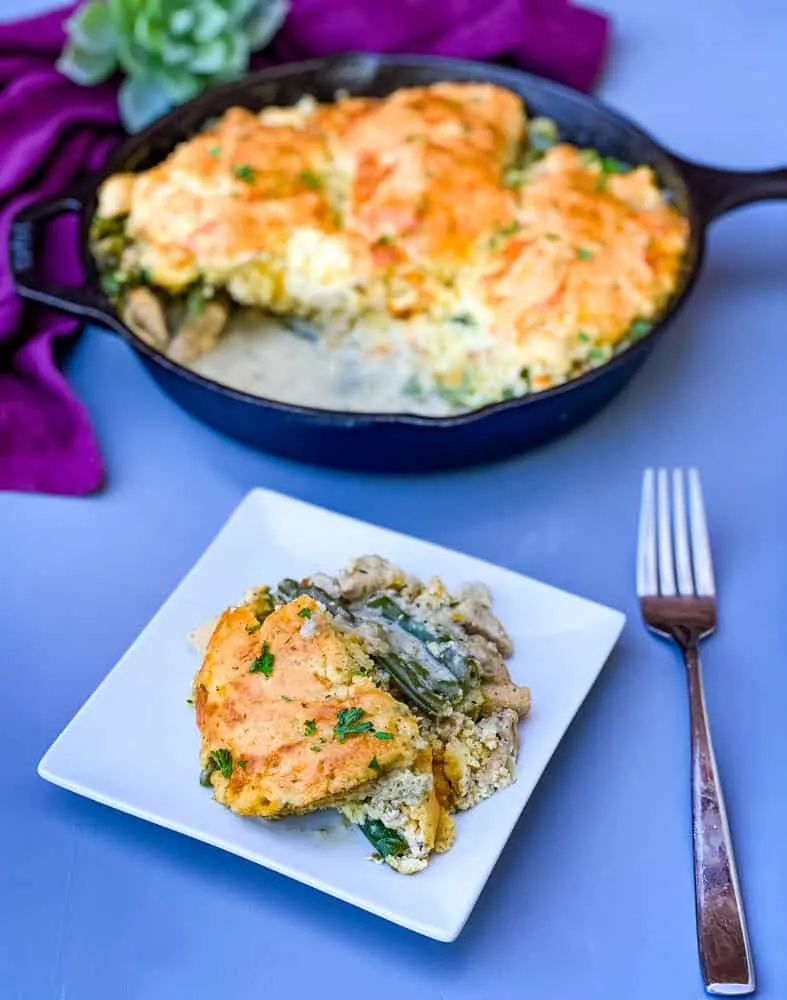 a slice of chicken pot pie and keto low carb chicken pot pie in a cast iron skillet