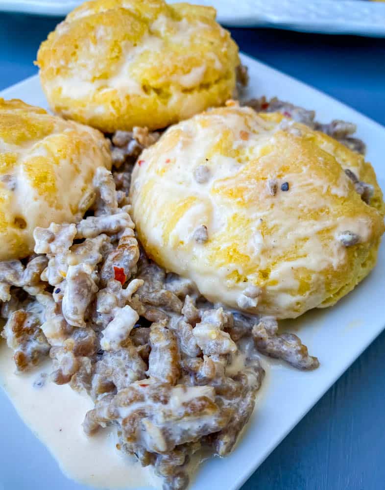 keto low carb biscuits and gravy on a white plate