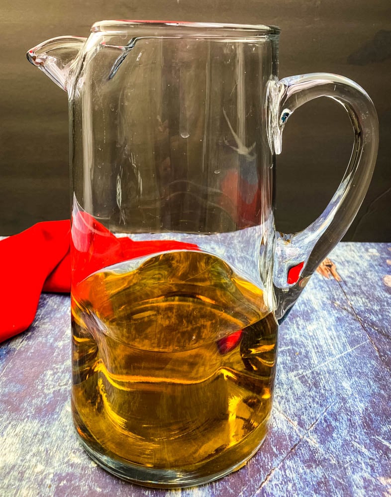 dark rum in a pitcher for Bahama Mama recipe