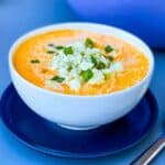 buffalo chicken soup in a white bowl with a spoon