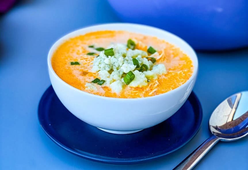 buffalo chicken soup in a white bowl with a spoon