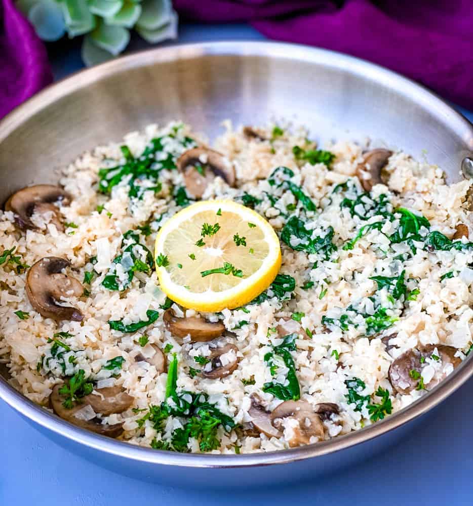 keto low carb cauliflower risotto in a pan with lemon