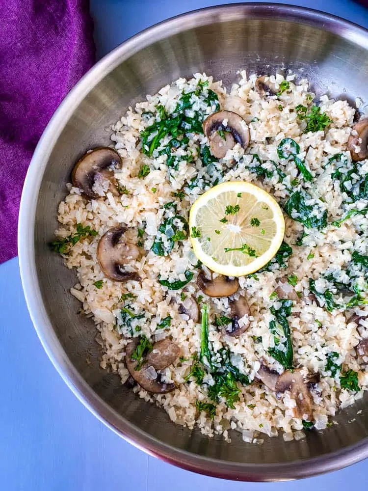 keto low carb cauliflower risotto in a pan with lemon