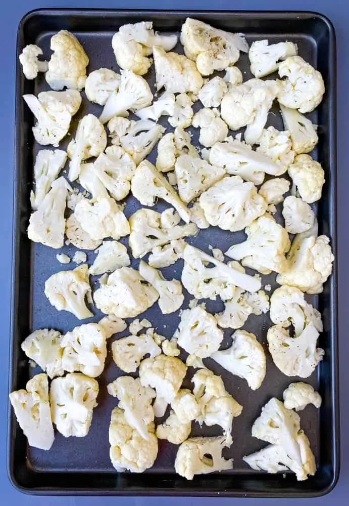 raw cauliflower on a sheet pan