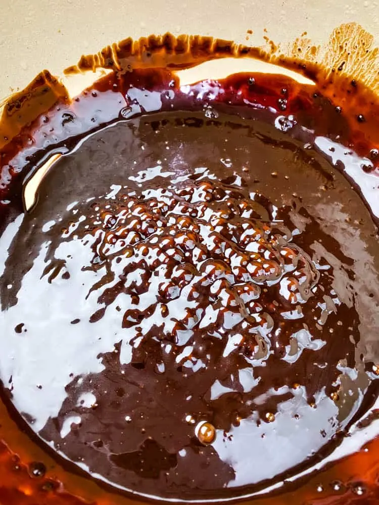 melted chocolate for keto low carb hot chocolate in a Dutch oven