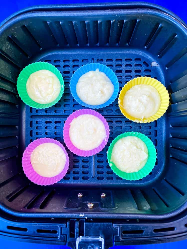 air fryer cornbread muffin batter in silicone molds in an air fryer