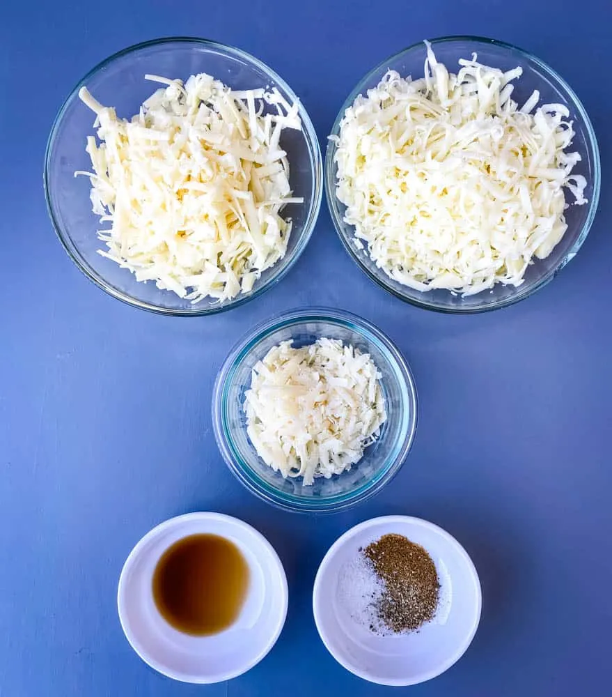 shredded mozzarella, white cheddar, and parmesan cheese with seasoning for crab rangoon dip
