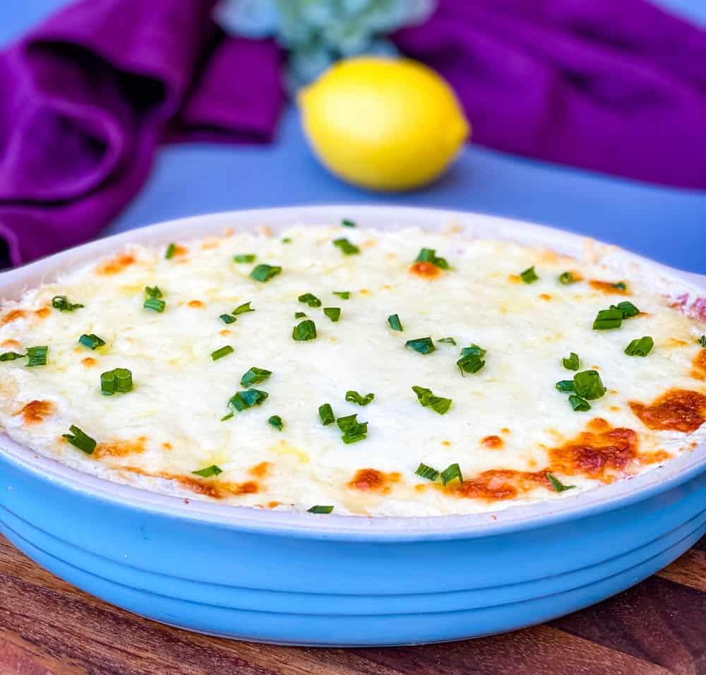 crab rangoon dip in a blue baking dish