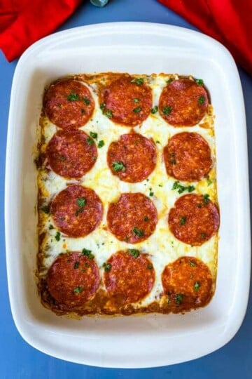 keto low carb pizza casserole in a red dish with a red napkin