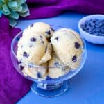 keto low carb chocolate chip cookie dough bites in a glass bowl with a purple napkin
