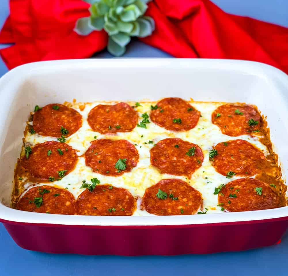 keto low carb pizza casserole in a red dish with a red napkin