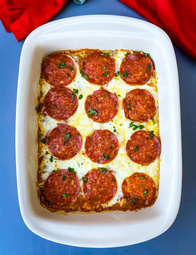 keto low carb pizza casserole in a red dish with a red napkin