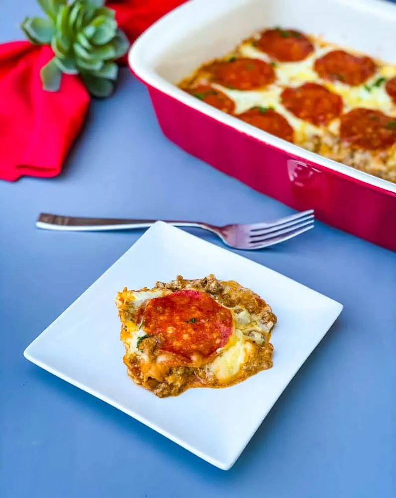 keto low carb pizza casserole in a red dish with a red napkin