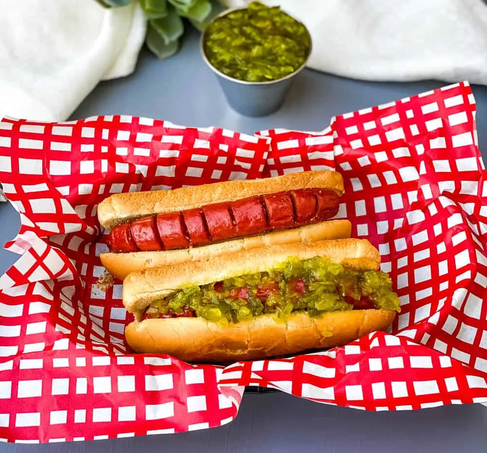 air fryer hot dog with relish and hot dog without toppings in a bowl