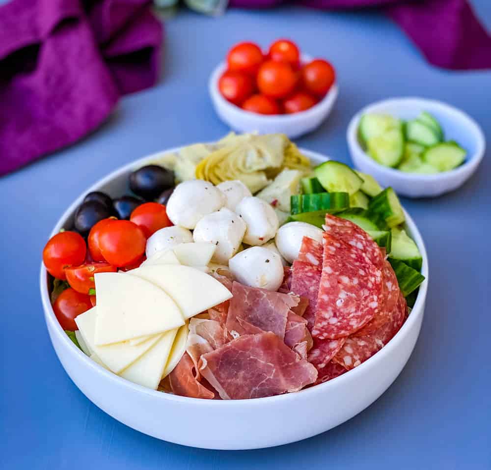 antipasto salad in a white bowl