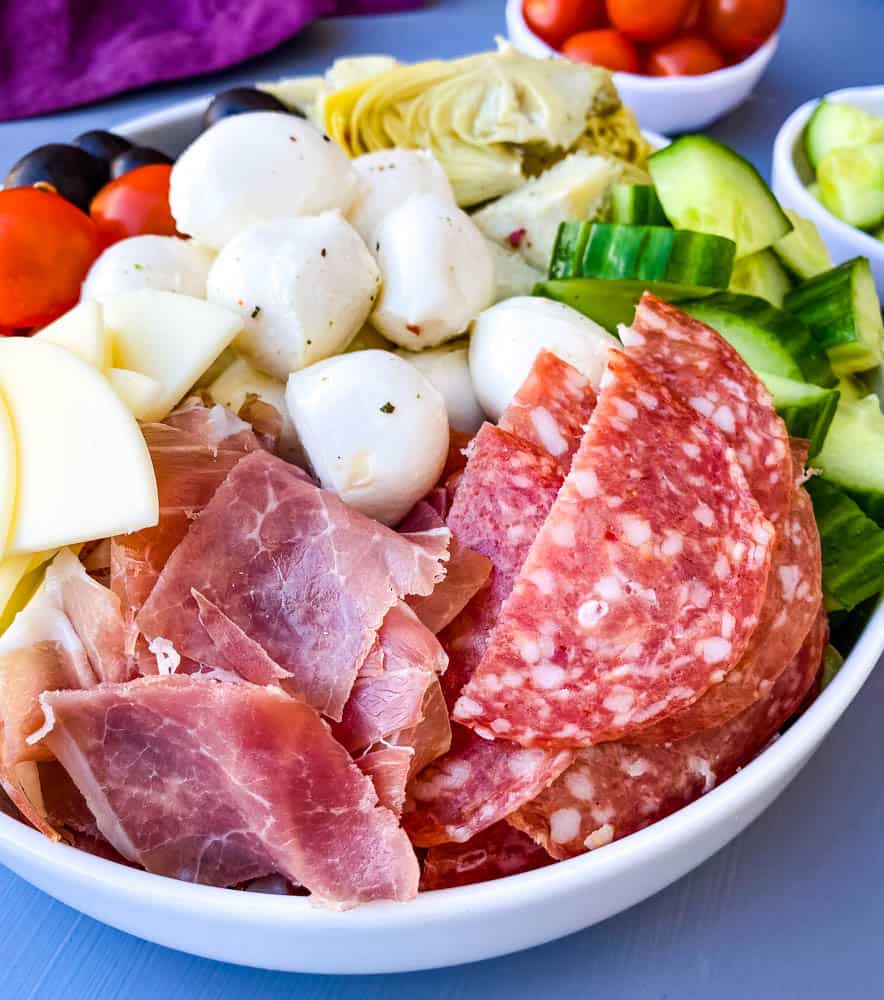 antipasto salad in a white bowl