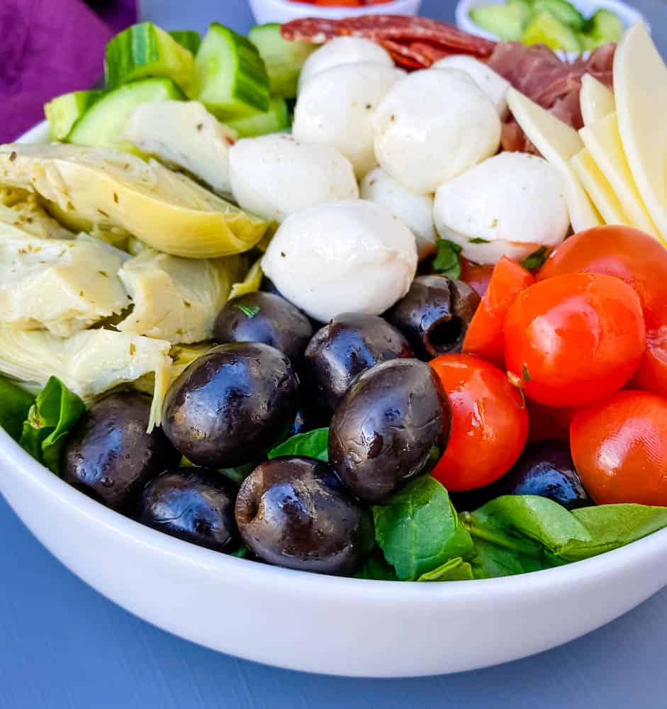 antipasto salad in a white bowl