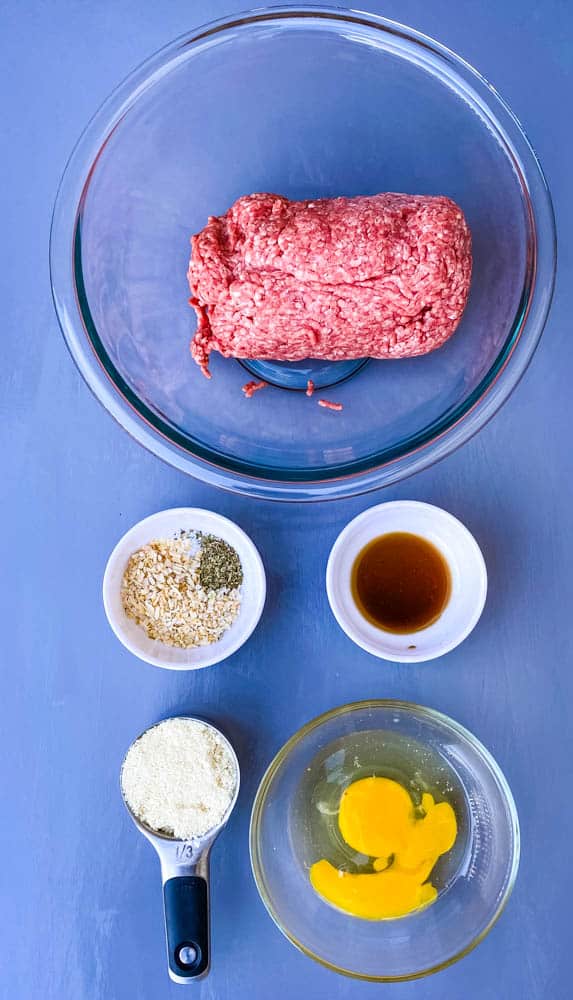 ground beef, garlic, eggs, worcestershire sauce and almond flour in separate bowls