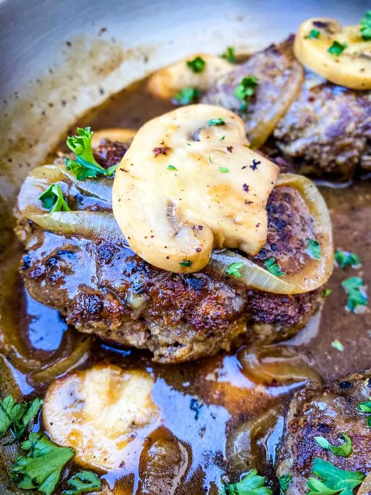 keto low carb salisbury steaks in a stainless steel pan