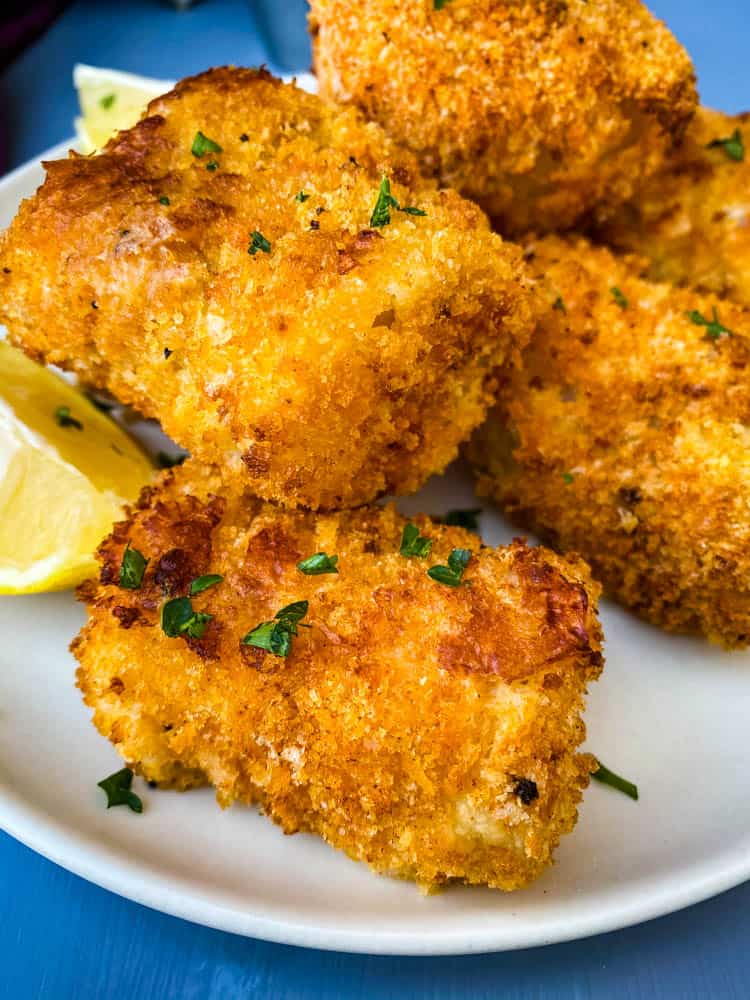 air fryer fish sticks on a white plate