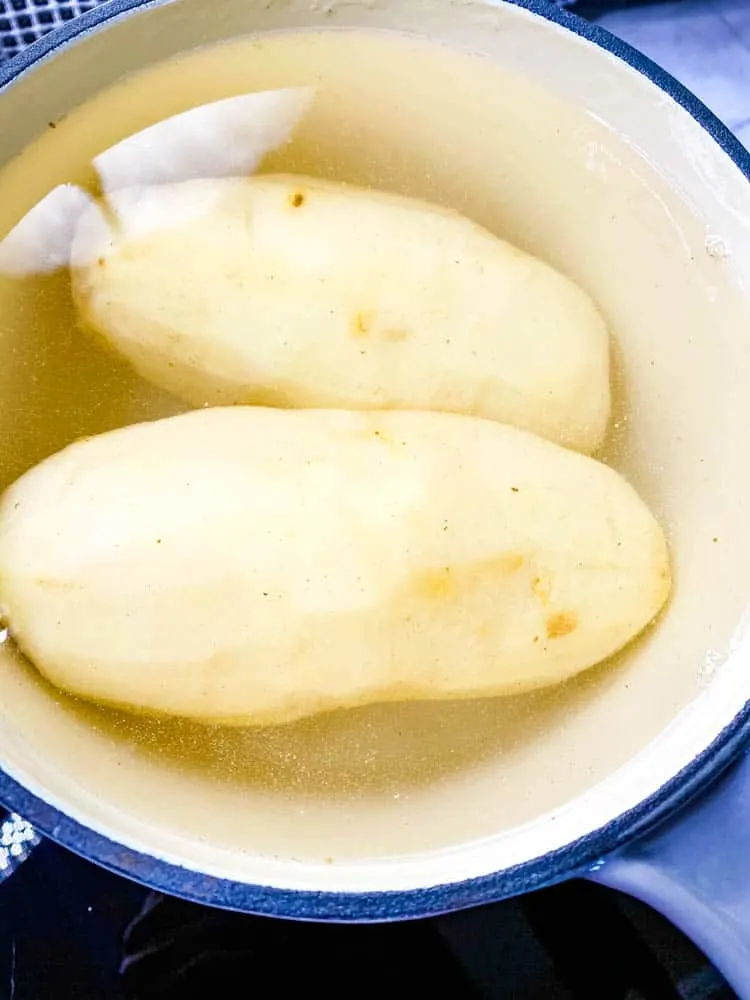 potatoes boiling in a saucepan