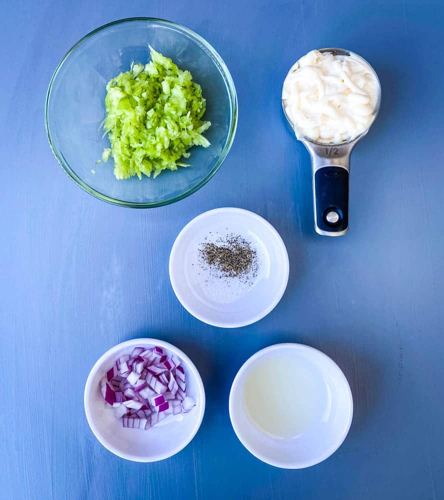 chopped celery, chopped onions, mayo, lemon juice, and seasoning in separate bowls