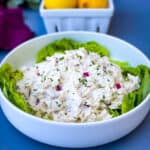 keto chicken salad on a bed of lettuce in a white bowl