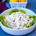 keto chicken salad on a bed of lettuce in a white bowl
