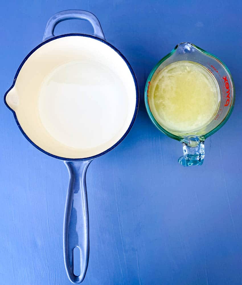 water in a saucepan and fresh lemon juice in a measuring cup