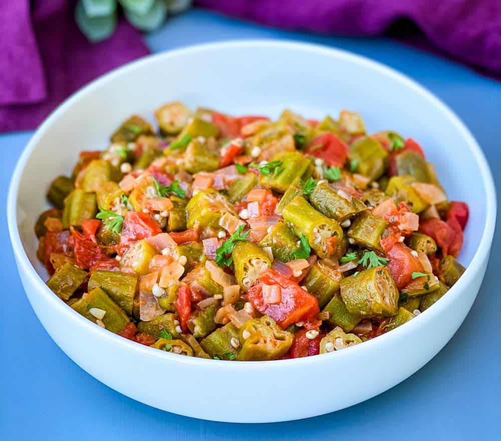 okra and stewed tomatoes in a white bowl