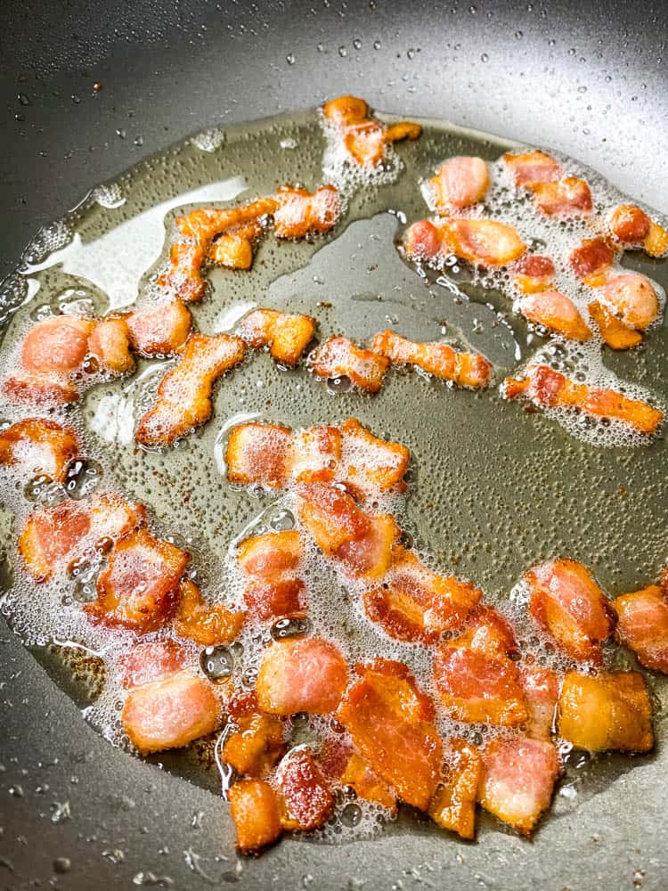 chopped and cooked bacon in a skillet