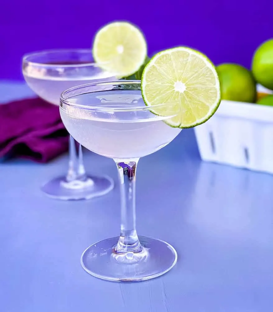 vodka gimlet cocktail in a glass garnished with a fresh lime