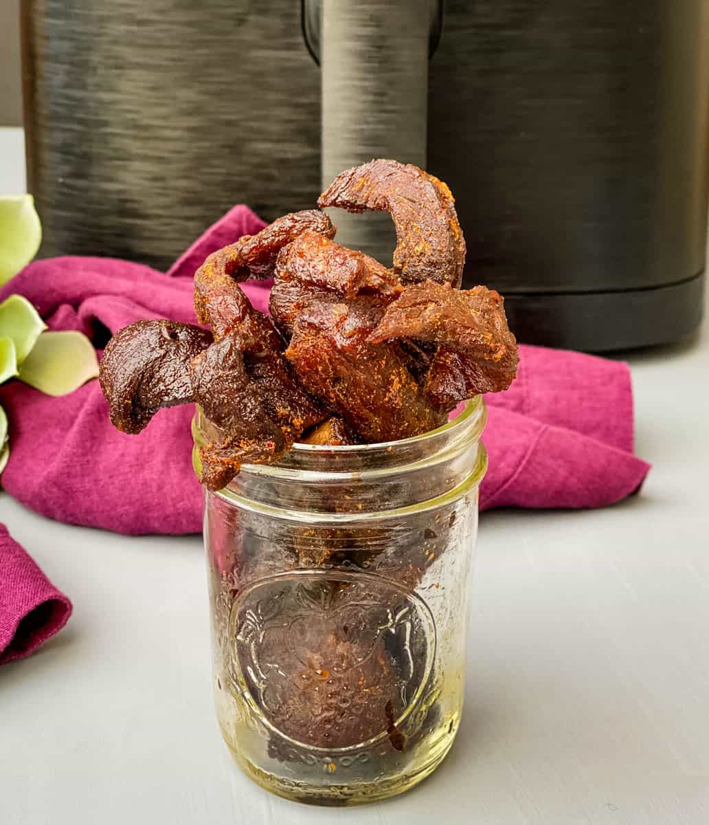air fryer beef jerky in a glass cup