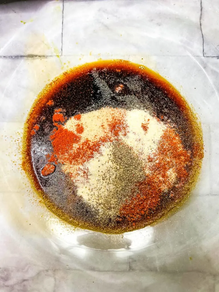 soy sauce, liquid smoke, and worcestershire sauce in a glass bowl