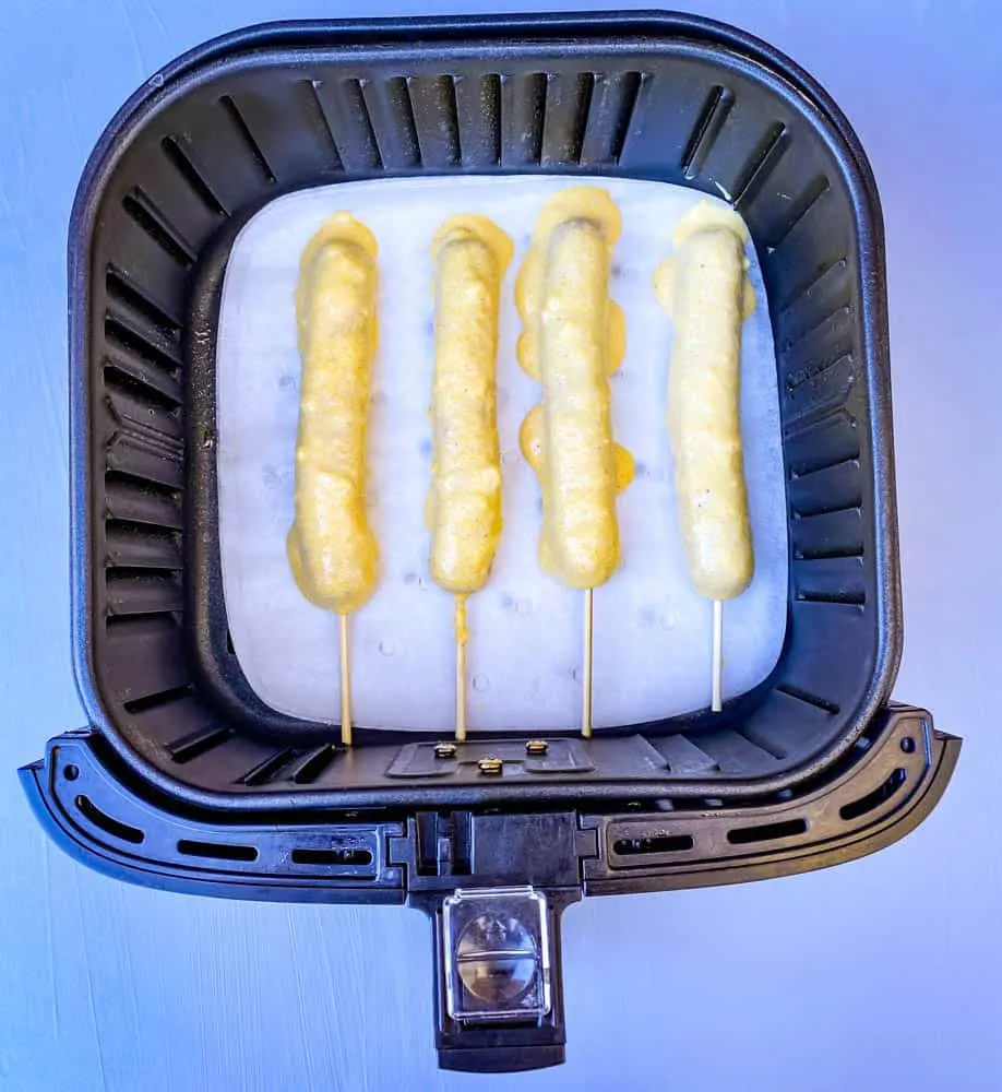 uncooked corn dogs in an air fryer