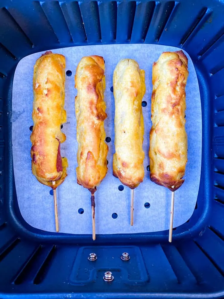 cooked corn dogs in an air fryer