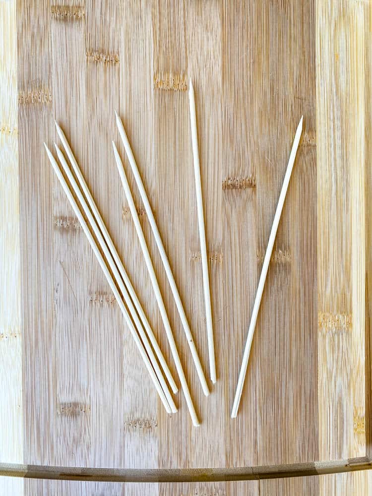 bamboo skewers on a bamboo cutting board