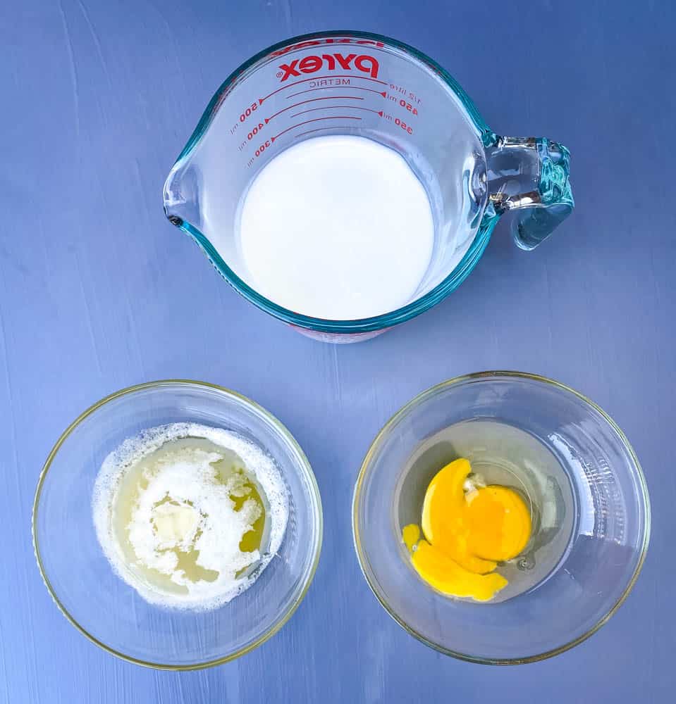 buttermilk, an egg, and melted butter in separate bowls