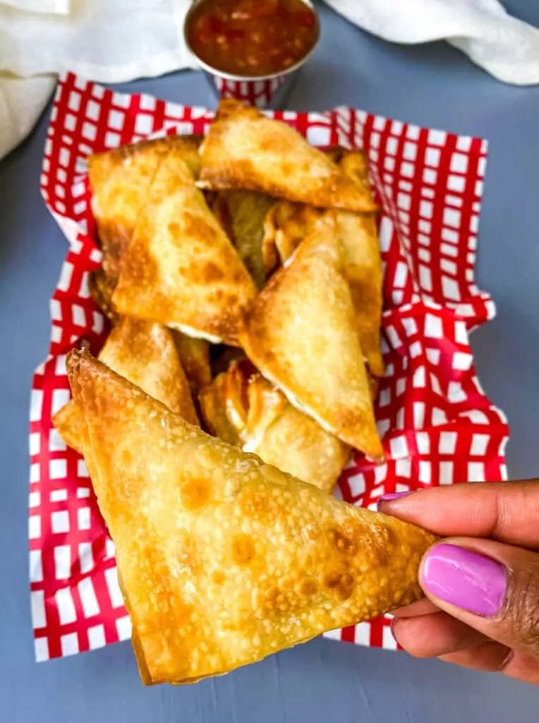 person holding air fryer wonton