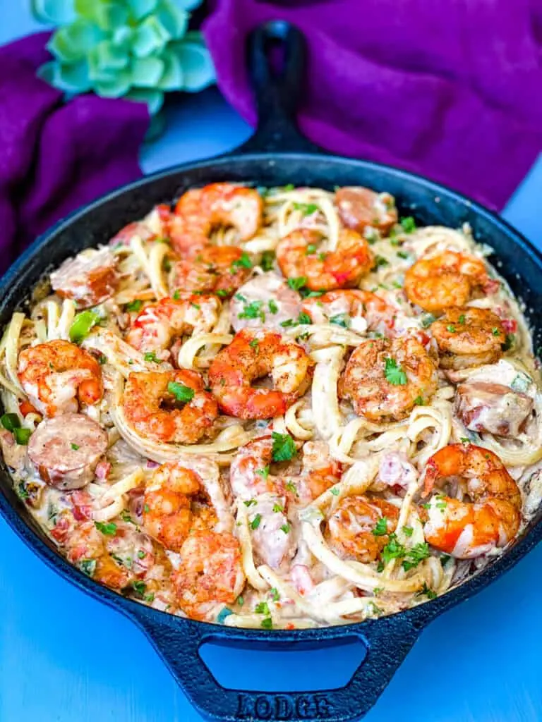 cajun shrimp pasta with linguine pasta in a cast iron skillet