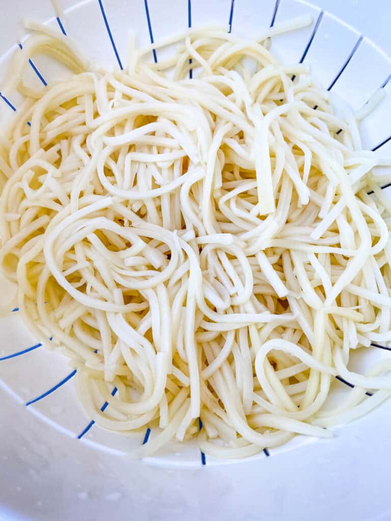 Palmini linguine pasta in a colander