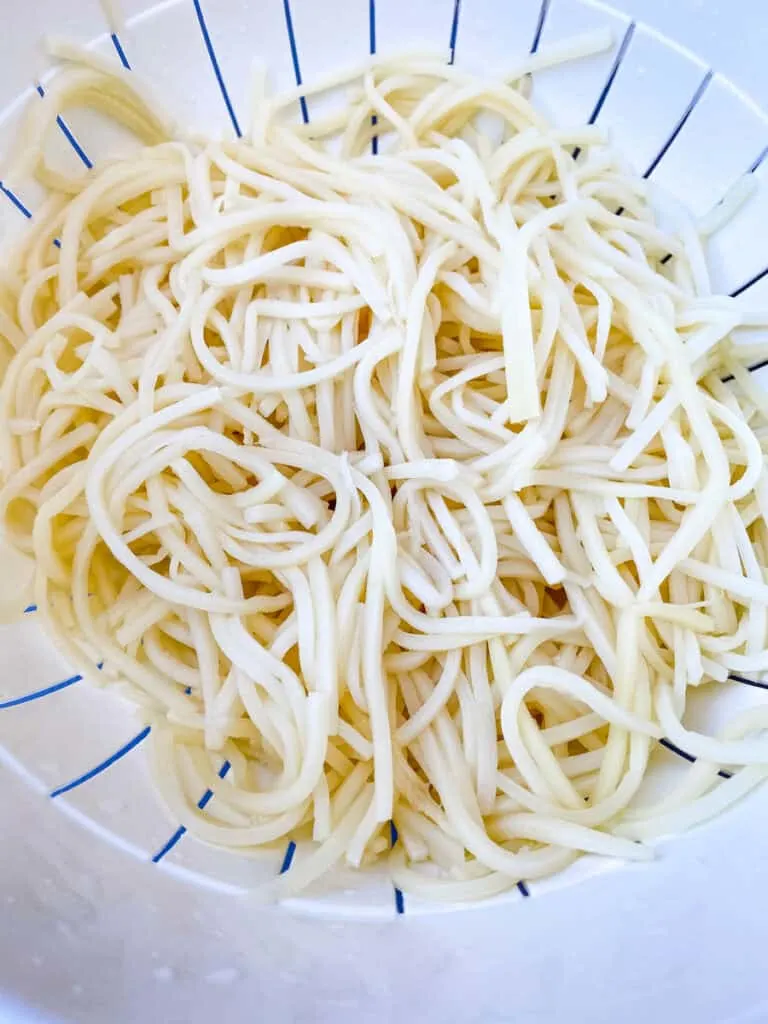 Palmini linguine pasta in a colander